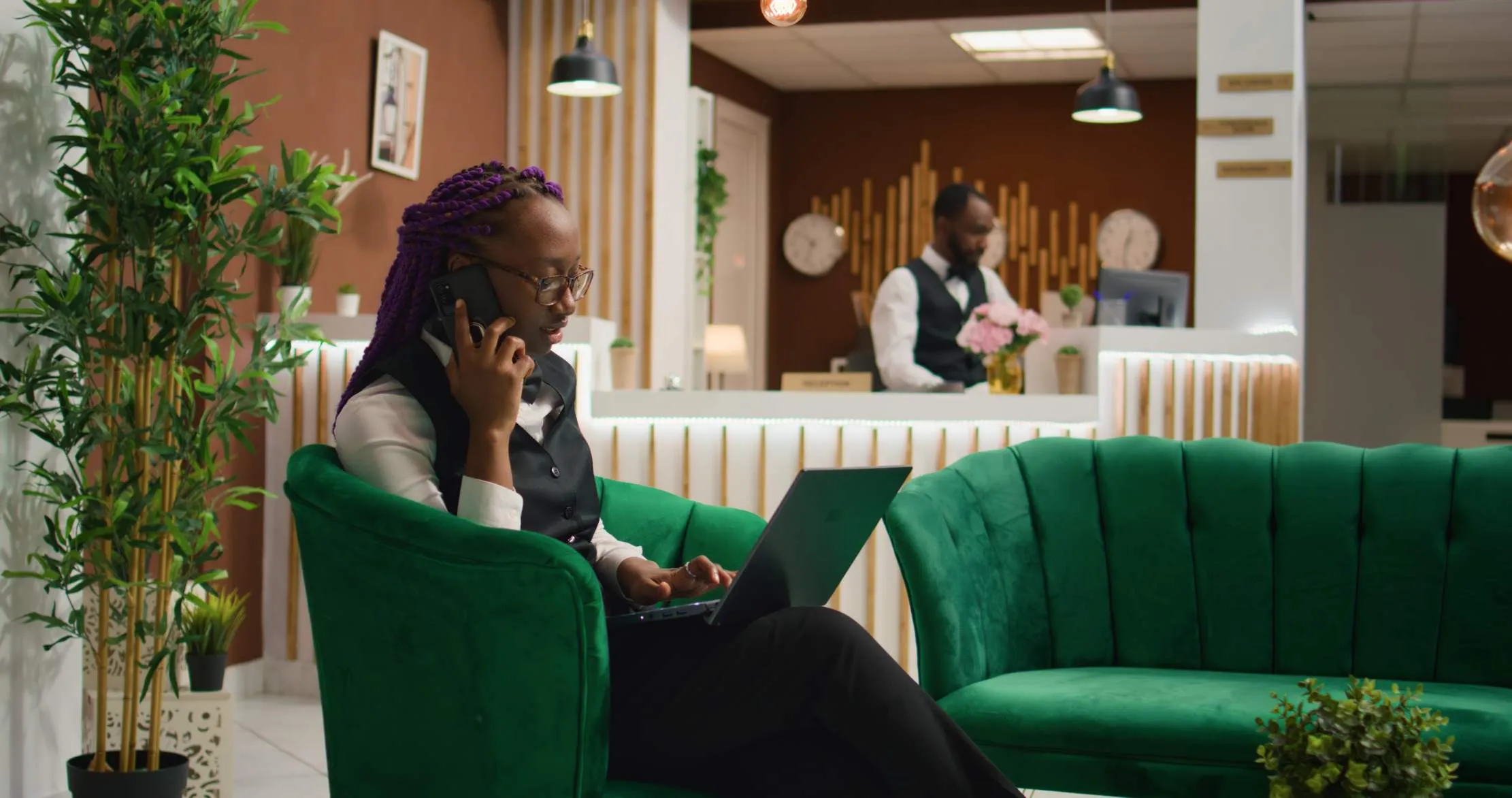 Hotel receptionist handling a guest inquiry