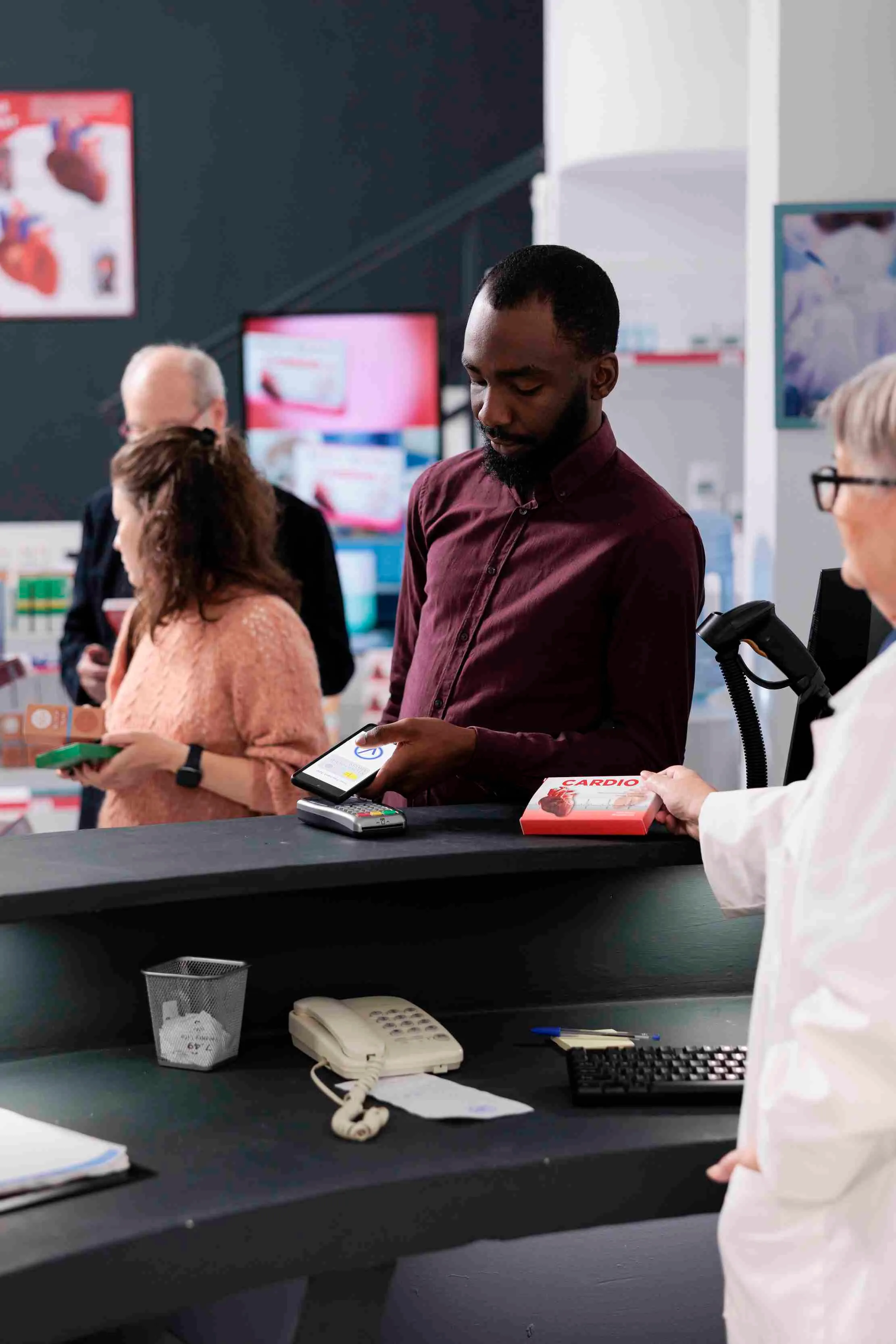 Pharmacist using a tablet to review medicine records and stock information