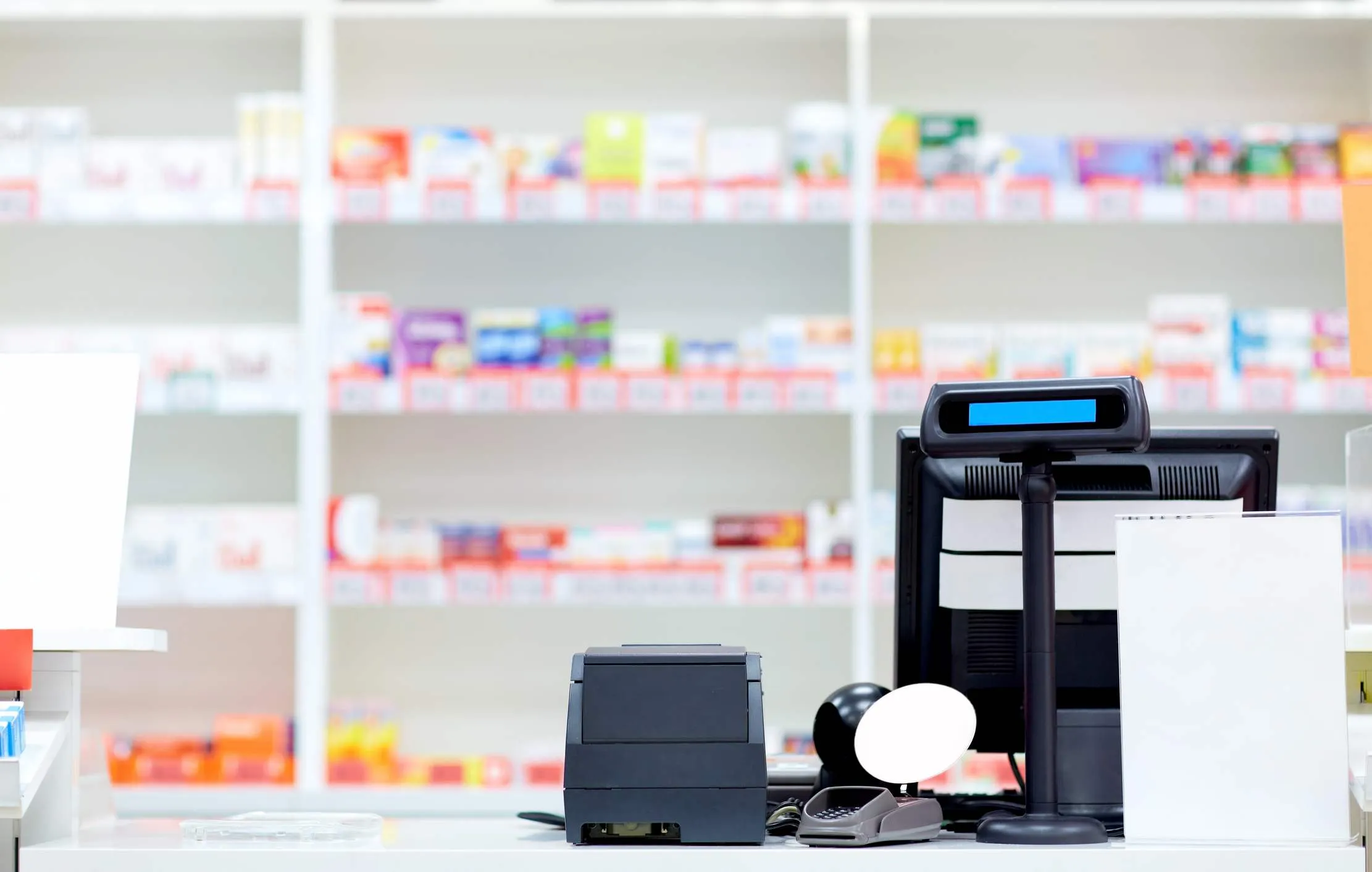 Pharmacist explaining treatment and dosage guidance to a patient
