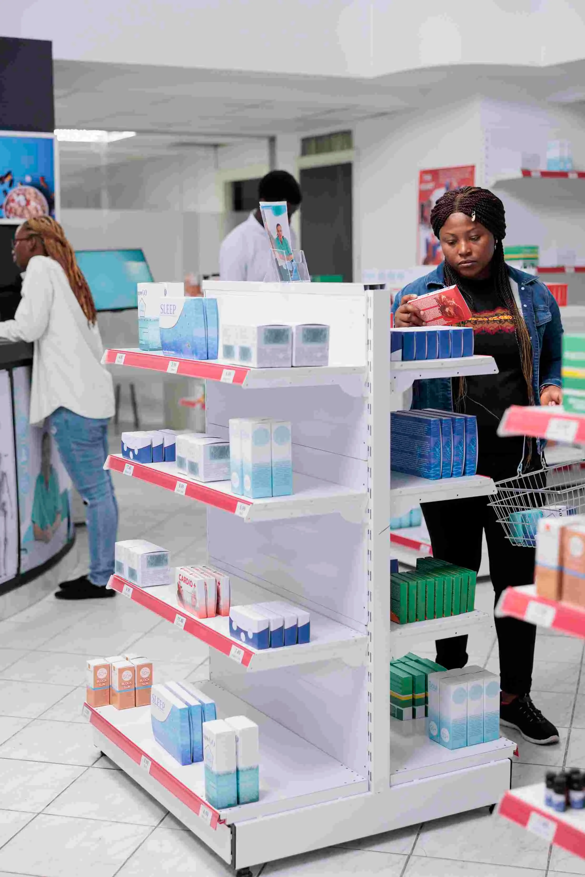 Retail owner standing in front of store shelves for stock visibility and reorder planning