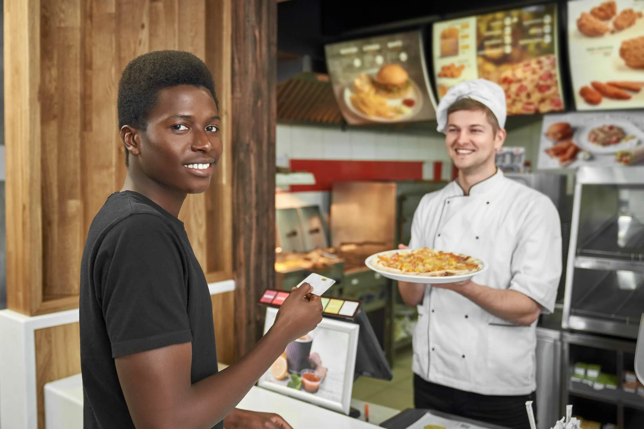 Counter service payment inside a busy restaurant environment